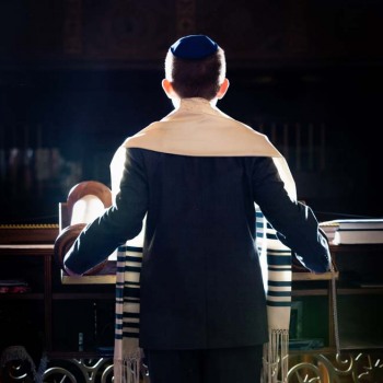 Bar mitzvah boy in temple