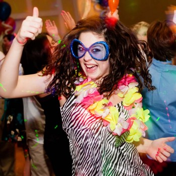 Guest with big blue party glasses