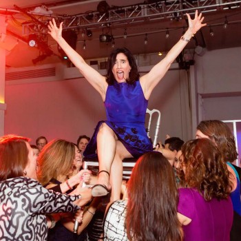 Ladies lift bar mitzvah mom during hora