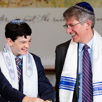 Father and bar mitzvah boy share laugh
