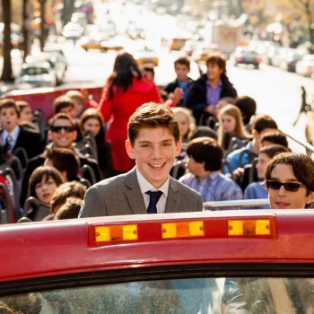 Bar mitzvah boy on bus with friends