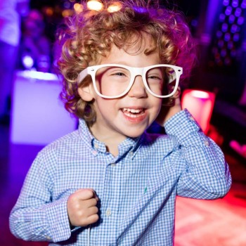 Young bar mitzvah guests in giant glasses