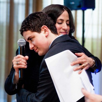 Mom gives bar mitzvah boy loving hug