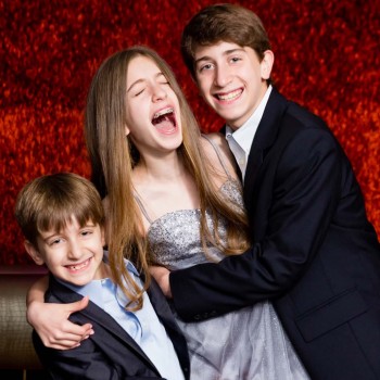 Bat mitzvah girl with two brothers