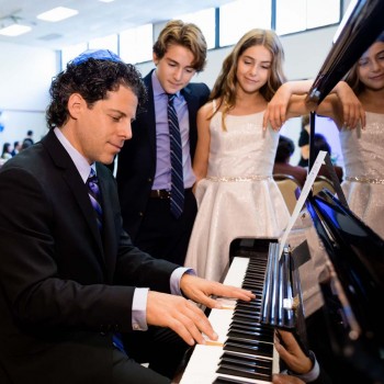 Dad of bar mitzvah twins plays piano