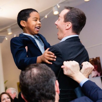 Father and son during hora