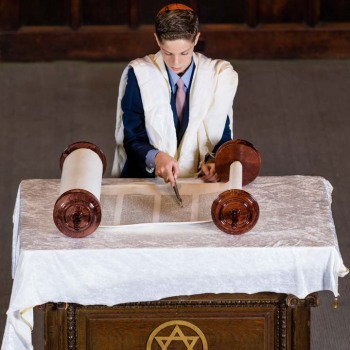 Bar mitzvah boy from temple balcony