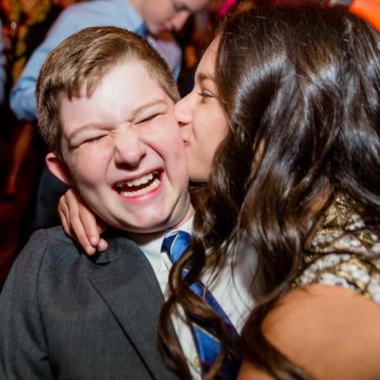 Mom of bar mitzvah boy kisses her son