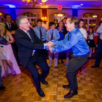 Men dancing hora at bar mitzvah