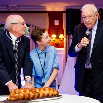 Grandfathers cut bar mitzvah-challah