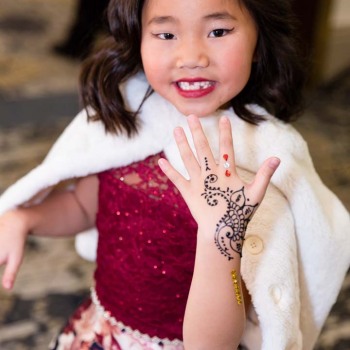 Young bat mitzvah guest adorned with hand henna
