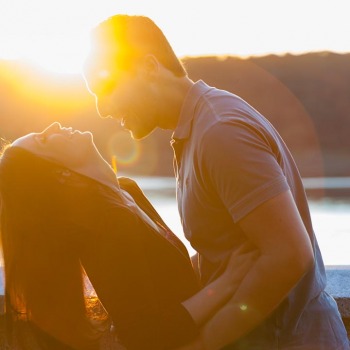 Happily engaged at sunset