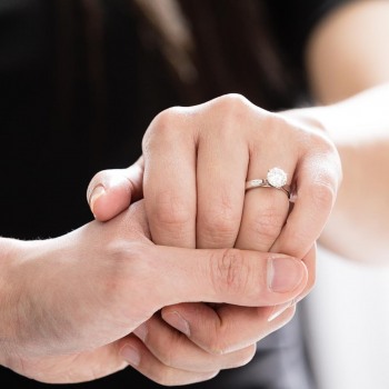Showing off the engagement ring