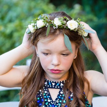 Flower-girl-adjusting-wreath