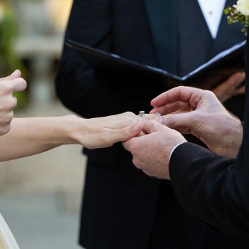 Groom-places-ring-on-hre-finger