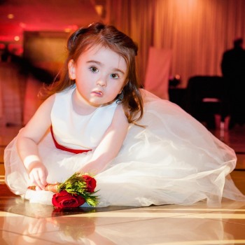 Beautiful flower girl on dance floor