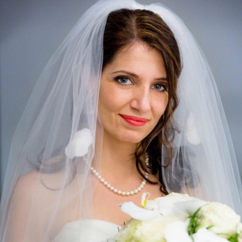 Traditional bridal portrait with veil and bouquet