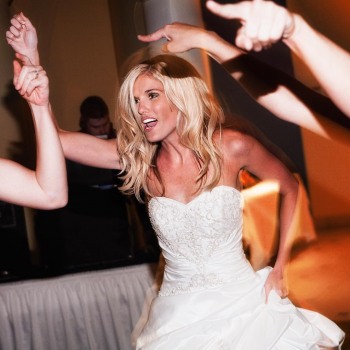 Bride dancing with her bridesmaids