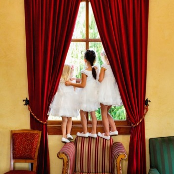 Little girls eagerly awaiting arrival of the bride