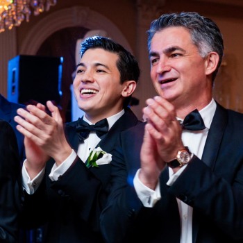 Guests applaud bride and groom during first dance