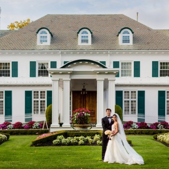 Formal wedding portrait outside in front of venue