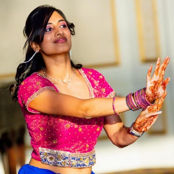 Celebratory dance by Indian bridesmaid