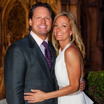 Portrait of newlyweds in front of chapel