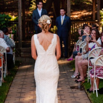 Walking up the aisle to her groom