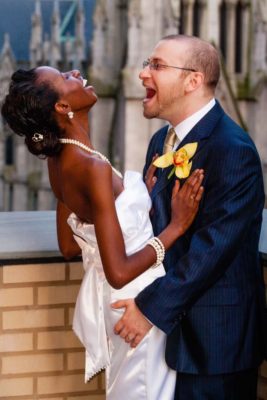 Happy Loving Day! Interracial couple celebrating after the wedding ceremony